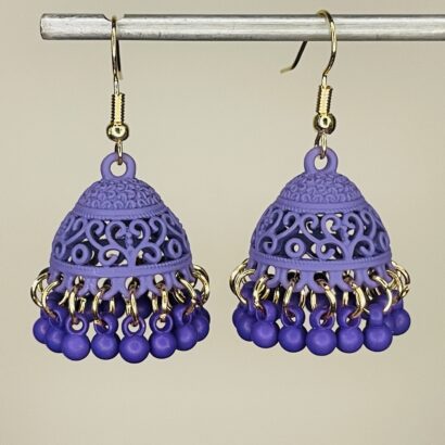 Pair of handcrafted lavender jhumka earrings with intricate floral design and dangling pink beads, featuring golden hooks and no golden bead detailing.