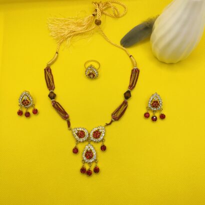 "Red stone necklace set with matching earrings and ring, embellished with crystals – party and festive wear jewelry for women"