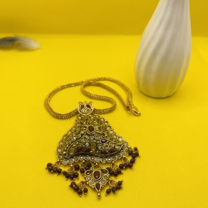 "Traditional kundan pendant necklace with red stone beads and golden chain – ethnic party and festive jewelry for women"