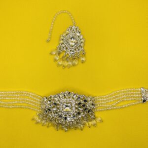 Bridal choker jewelry set featuring a central brilliant-cut crystal necklace surrounded by clear, transparent acrylic beads. The set includes matching crystal and transparent bead jhumka earrings and a maang tikka